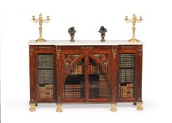 ϒ A Regency rosewood and gilt metal mounted breakfront side cabinet
