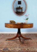 ϒ A George III mahogany drum library table