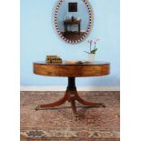 ϒ A George III mahogany drum library table