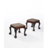 A companion pair of George II Irish mahogany stools