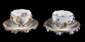 A Meissen flower-encrusted cabinet cup and saucer