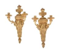 A pair of Continental giltwood twin light wall appliques in Louis XVI style