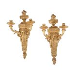 A pair of Continental giltwood twin light wall appliques in Louis XVI style