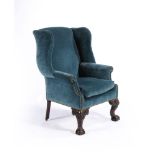 An Irish mahogany and upholstered wing armchair