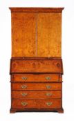 A George II burr walnut bureau cabinet