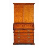 A George II burr walnut bureau cabinet