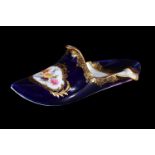 A Meissen blue-ground model of a slipper