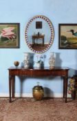 A George III mahogany serpentine fronted serving table