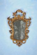 A Continental carved giltwood and etched glass wall mirror