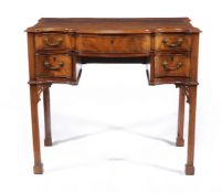 A George III mahogany serpentine fronted writing table