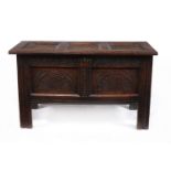 A Charles II panelled oak chest