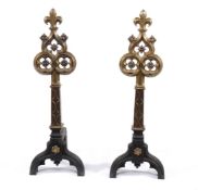 A pair of fine Victorian brass mounted cast iron andirons in Gothic style