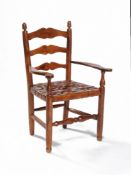 A solid yew child's chair by Russell & Sons