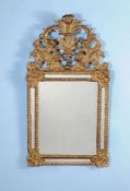 A Régence giltwood and gesso wall mirror