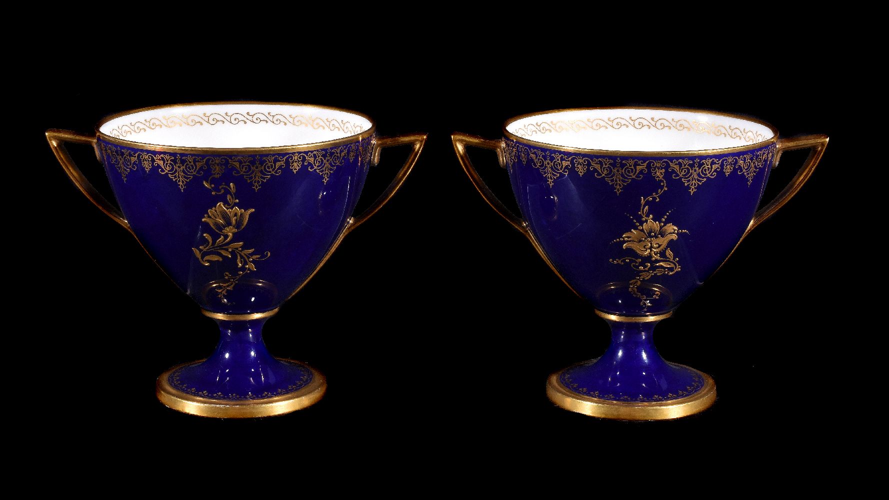 A pair of Royal Worcester blue-ground and gilt two-handled cabinet cups signed and painted by George - Image 2 of 3