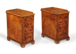 A pair of burr walnut bedside pedestal chests