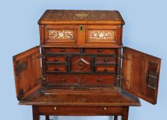 ϒ A Commonwealth walnut, mother of pearl and bone inlaid table top cabinet