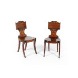 A pair of Regency mahogany hall chairs