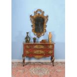 A Venetian painted and parcel gilt serpentine commode