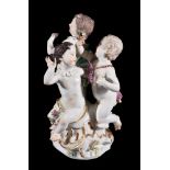 A Meissen allegorical group of three putti