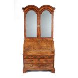 A Queen Anne walnut, burr-walnut and feather banded bureau cabinet