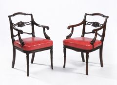 A set of twelve Regency mahogany armchairs