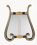 A pair of black painted and parcel gilt wall mirrors
