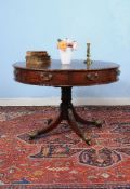 A George III mahogany drum library table