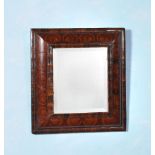 A William & Mary olivewood oyster veneered cushion framed mirror