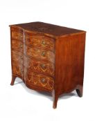 A George III mahogany and marquetry decorated serpentine fronted chest of drawers