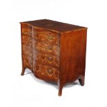 A George III mahogany and marquetry decorated serpentine fronted chest of drawers