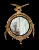 A George III giltwood and gesso girandole convex wall mirror
