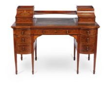 ϒ An Edwardian mahogany and specimen marquetry desk by EDWARDS & ROBERTS