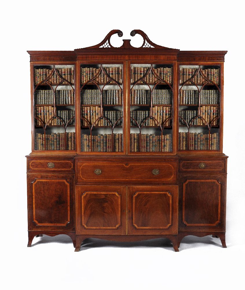 A George III 'plum pudding' mahogany and satinwood banded breakfront secretaire library bookcase