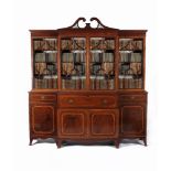 A George III 'plum pudding' mahogany and satinwood banded breakfront secretaire library bookcase