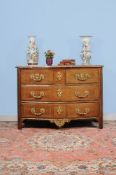 ϒ A Louis XV rosewood and gilt metal mounted serpentine fronted commode