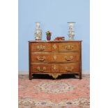 ϒ A Louis XV rosewood and gilt metal mounted serpentine fronted commode