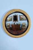 A Regency giltwood circular convex wall mirror