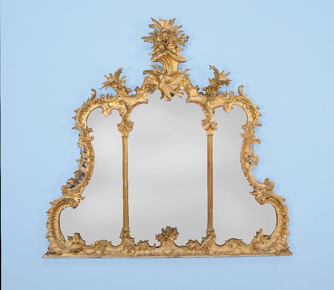 A carved giltwood overmantel mirror in George III style