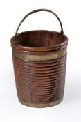 A George III mahogany and brass mounted peat bucket