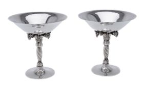 ϒ Georg Jensen, a pair of Danish silver Grape pattern pedestal bowls