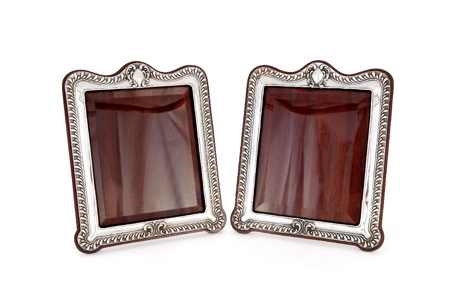 A matched pair of turn-of-the-century silver photograph frames by William Neale & Son