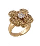 A diamond and yellow sapphire Flower ring by Van Cleef & Arpels