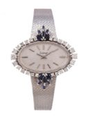 A lady's 18 carat white gold, diamond and sapphire bracelet watch