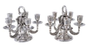 Georg Jensen, a pair of Danish silver Grape pattern candelabra