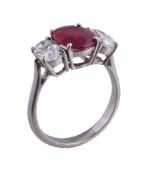 A ruby and diamond three stone ring