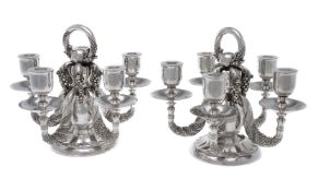 Georg Jensen, a pair of Danish silver Grape pattern candelabra