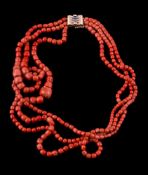 ϒ A three strand coral bead necklace