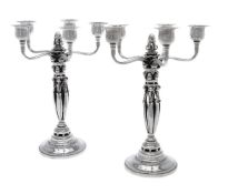 Georg Jensen, a pair of Danish silver Grape pattern five-light candelabra