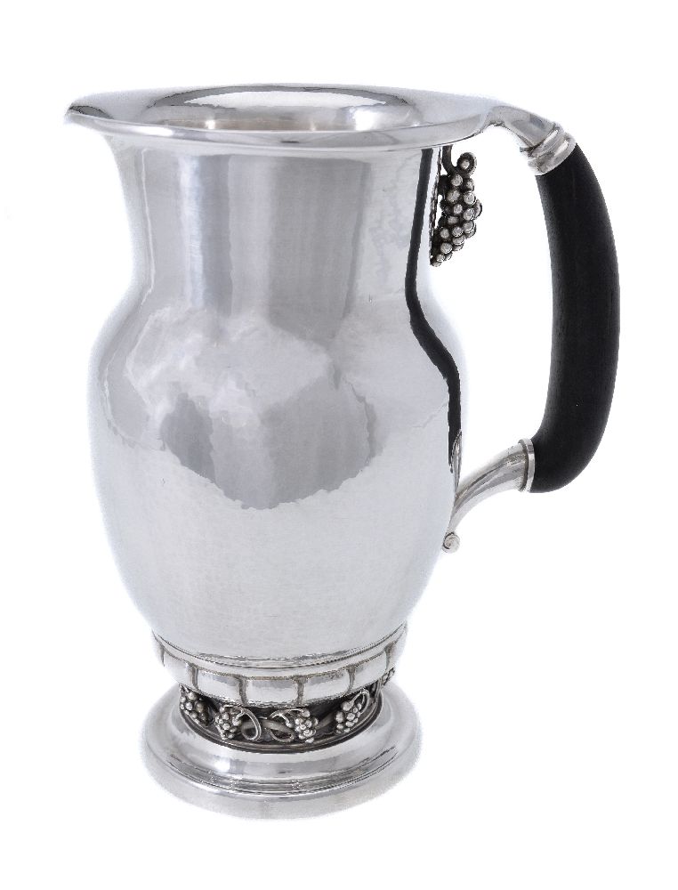 ϒ Georg Jensen, a Danish silver Grape pattern pitcher or jug